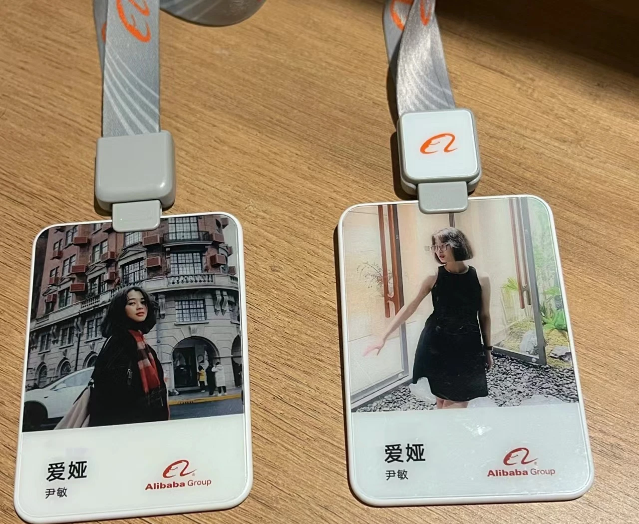 Two Alibaba Group staff badges on lanyards, each with Yin Min's name.